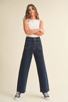 The Caroline denim pant by Miou Muse features a deep indigo pre-stretched denim. Size chart in photos. Model is wearing size S Measurements taken from size S Height - 5' 7 1/2" / 175.3CM 33(Bust) - 24(Waist) - 34(Hips) Fabric: 98% Cotton 2% Spandex Deep Indigo, The Lane, Indigo Denim, Denim Pant, Contrast Stitch, Crop Tee, Straight Leg Pants, Wide Leg Jeans, Classic Looks