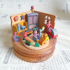 a wooden toy train set on top of a table