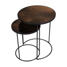 two tables sitting on top of each other with metal bases and wood tops, one in the shape of a circle