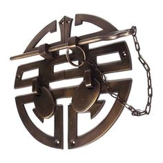 a circular metal object with chains hanging from it's center and two circles in the middle