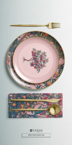 a pink plate with gold trim and two forks next to it on a white surface