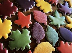 many colorful cookies are arranged on a table