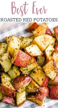 cooked potatoes with herbs and seasoning sitting on a checkered paper towel, ready to be eaten