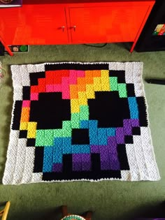 a crocheted blanket made to look like a skull