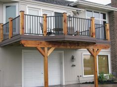 a two story house with an attached deck