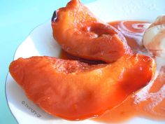 two pieces of fried food on a white plate