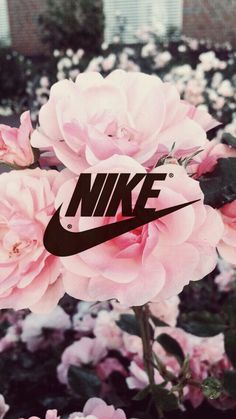 a pink flower with the nike logo on it's front and bottom corner is shown