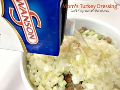 a bowl filled with rice and meat next to a carton of mayonnaise