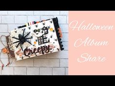 an altered halloween album on a brick wall with the words, happy halloween and a spider