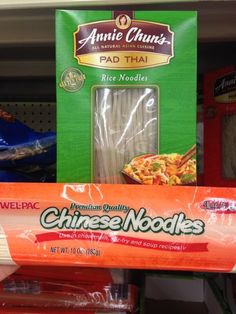 an assortment of chinese noodles on display in a grocery store, including pad thai noodles and rice noodles