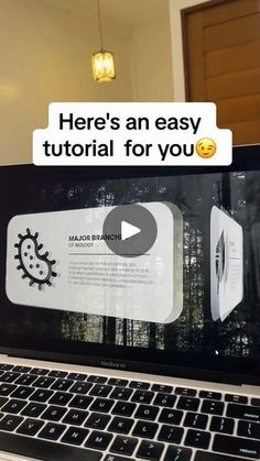 an open laptop computer sitting on top of a desk with the text here's an easy video for you