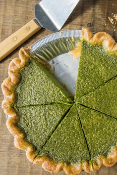 a pie is cut into pieces and sitting on a table