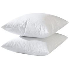 two white pillows stacked on top of each other