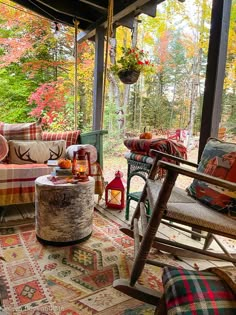 a porch covered in lots of furniture and decor