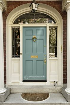 a blue front door with white columns and pillars