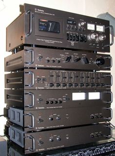 a stack of stereo equipment sitting on top of each other