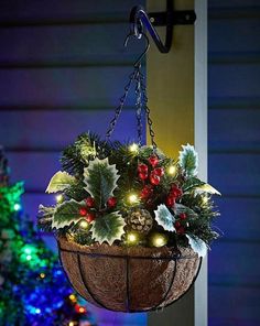 a hanging basket filled with christmas decorations