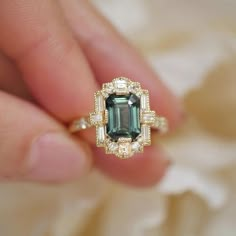 Multi-Cut Engagement Ring, Green Emerald Gemstone Ring, Milgrain Ring, Halo Wedding Ring, Solitaire WithAccent Ring, Bezel Set Ring,14KGold  Item Description: *Main Stone: Cubic Zirconia *Stone Shape: emerald Side Stone: Cubic Zirconia 1. White Gold: 10K/14K/18K 2. Yellow Gold: 10K/14K/18K 3. Rose Gold: 10K/14K/18K 4. Silver: Sterling Silver 925 Size Customization: What Size you want... * You can also Customize ring size in US 4 to US 12! It sometimes affects to price. * Main Stone & Shape Custo Heirloom Style Emerald Cut Sapphire Ring With Accent Stones, Heirloom Emerald-cut Sapphire Ring With Accent Stones, Heirloom Emerald Cut Sapphire Ring With Accent Stones, Heirloom Sapphire Ring With Emerald Cut And Accent Stones, Exquisite Emerald Cut Sapphire Wedding Ring, Art Deco Sapphire Ring With Accent Stones For Wedding, Art Deco Sapphire Wedding Ring With Accent Stones, Heirloom Green Sapphire Ring For Wedding, Heirloom Green Sapphire Wedding Ring