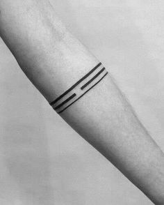 a black and white photo of a person's arm with two lines on it