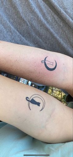 two people with matching tattoos on their arms