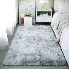 a white rug on the floor in a bedroom