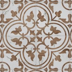 an ornate tile pattern with brown and white designs