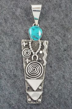 This Kingman turquoise and sterling silver pendant was made by Navajo silversmith Alex Sanchez. The back is signed Alex Sanchez and stamped sterling.Length: 4 1/4"Width: 1 1/8"Free shipping on all orders! We ship with USPS and always include tracking. All orders ship within a day of payment.Returns are accepted up to 30 days after you receive your order. Just send us a message. Our shop offers cash back or store credit. The item must be returned in new condition. Alex Sanchez, Turquoise Jewelry Native American, Southwest Jewelry, Kingman Turquoise, Silver Jewelry Handmade, Native American Jewelry, Turquoise Sterling Silver, Turquoise Jewelry, Sterling Silver Pendant