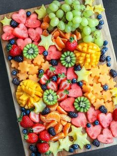 there are many different fruits on the cutting board