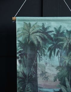 an image of a tropical scene hanging on a wall