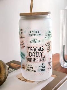 a teacher's daily affirmitions canister with a straw in it