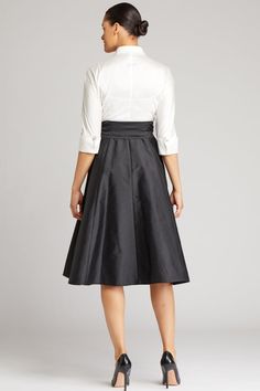 The essential closet staple shirtdress is back! Made in our classic taffeta this Black and White color blocked dress features a 3/4 sleeve collar and a tie at the waist. White taffeta bodice Full black taffeta skirt Wide collar 3/4 length sleeves Removable belt Wear with: black shoes Perfect for: mother of the bride mother of the groom black tie gala Style is also available as a floor-length gown: style 99026BLW Groom Black Tie, Black Taffeta Skirt, Tznius Fashion, Taffeta Skirt, Teri Jon, Gown Style, Black Tie Gala, Rehearsal Dress, Floor Length Gown