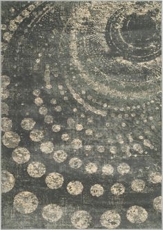 an area rug with circles and dots in grey, beige and white colors on a black background