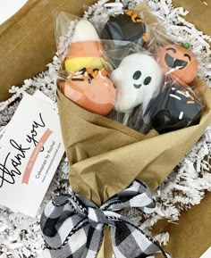 a box filled with halloween cookies on top of a table