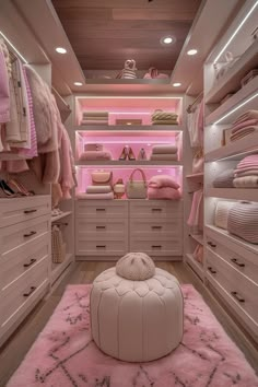 a walk in closet filled with lots of pink furniture and accessories, including a round ottoman