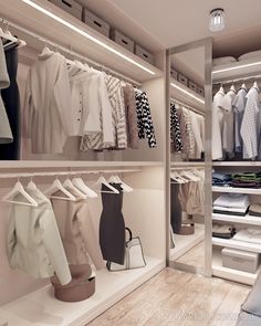 an open closet with clothes and shoes on the shelves in front of it is a mirror