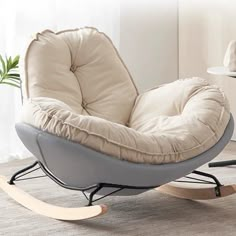 a rocking chair with a pillow on top of it