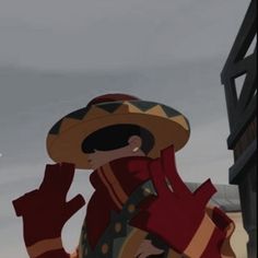 a cartoon character wearing a sombrero and holding his hand up to his face