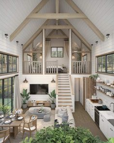 a living room filled with furniture next to a kitchen and dining area in a house