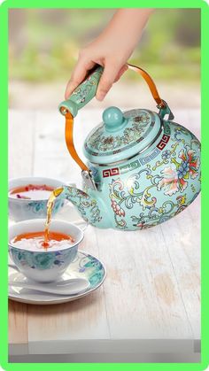 tea being poured into a cup with saucer