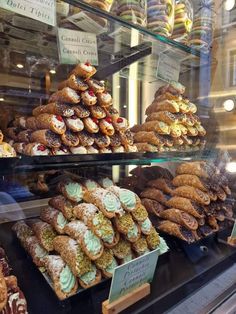 a display case filled with lots of different types of pastries