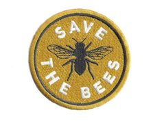 the save the bees logo on a yellow and black patch