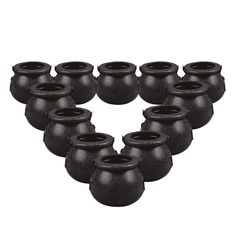 twelve black ceramic vases are arranged in the shape of a heart on a white background