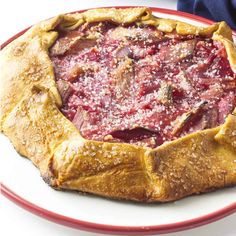 a piece of pie on a red and white plate