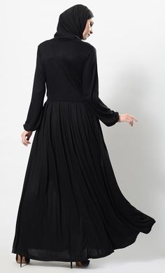 Featuring an elegant wrap around muslimah abaya dress in viscose lycra fabric with crisscross pleated panel on the front bodice and broad waistband adorned with two contrast colour buttons on the side. Its a modern wear ensemble perfect for casual ocassions.FIT : Relaxed fit.COMPOSITION : Viscose lycra.CARE : Dry clean only. Fitted Modest Long Sleeve Abaya, Modest Floor-length Abaya, Modest Solid Color Floor-length Abaya, Modest Black Floor-length Maxi Dress, Black Modest Floor-length Maxi Dress, Modest Fitted Black Abaya, Fitted Solid Maxi Length Abaya, Fitted Modest Maxi Dress With Modesty Panel, Modest Abaya With Modesty Panel