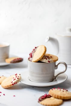 some cookies are in a cup on a table