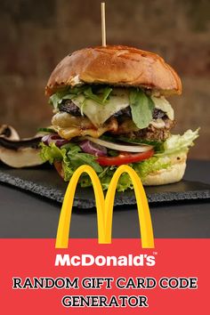 a large hamburger sitting on top of a black plate