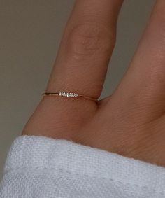 Solid 14k gold with 5 bright white genuine diamonds. A very tiny ring, perfect to stack. This pinky ring can be selected as open in the back so it is adjustable. If open back, it can be adjusted yourself to be as small as a size 2 and as large as a 4.5, including every size in between. It can also be worn as a knuckle ring! The closed back version is much more durable. If you plan to wear this ring 24/7 it is recommended to order the closed back. Available in an adjustable one size fits all open back style, or as a closed single sized ring. Please note the closed size is custom made to order and final sale, be sure of your ring size. Also available in 14k rose gold, email info@belladaar.com to order. Women’s Pinky Rings, Tiny Diamond Jewelry, Dainty Pinky Ring, Diamond Pinky Ring For Women, Gold Pinky Ring Women, Pinkie Rings For Women, Pinky Promise Rings, Gold Ring Ideas, Gold Pinky Rings