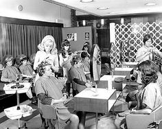 a group of women sitting at desks in a room