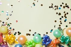 balloons, streamers and confetti on a white background