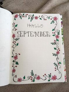 an open notebook with the words hello november written in it